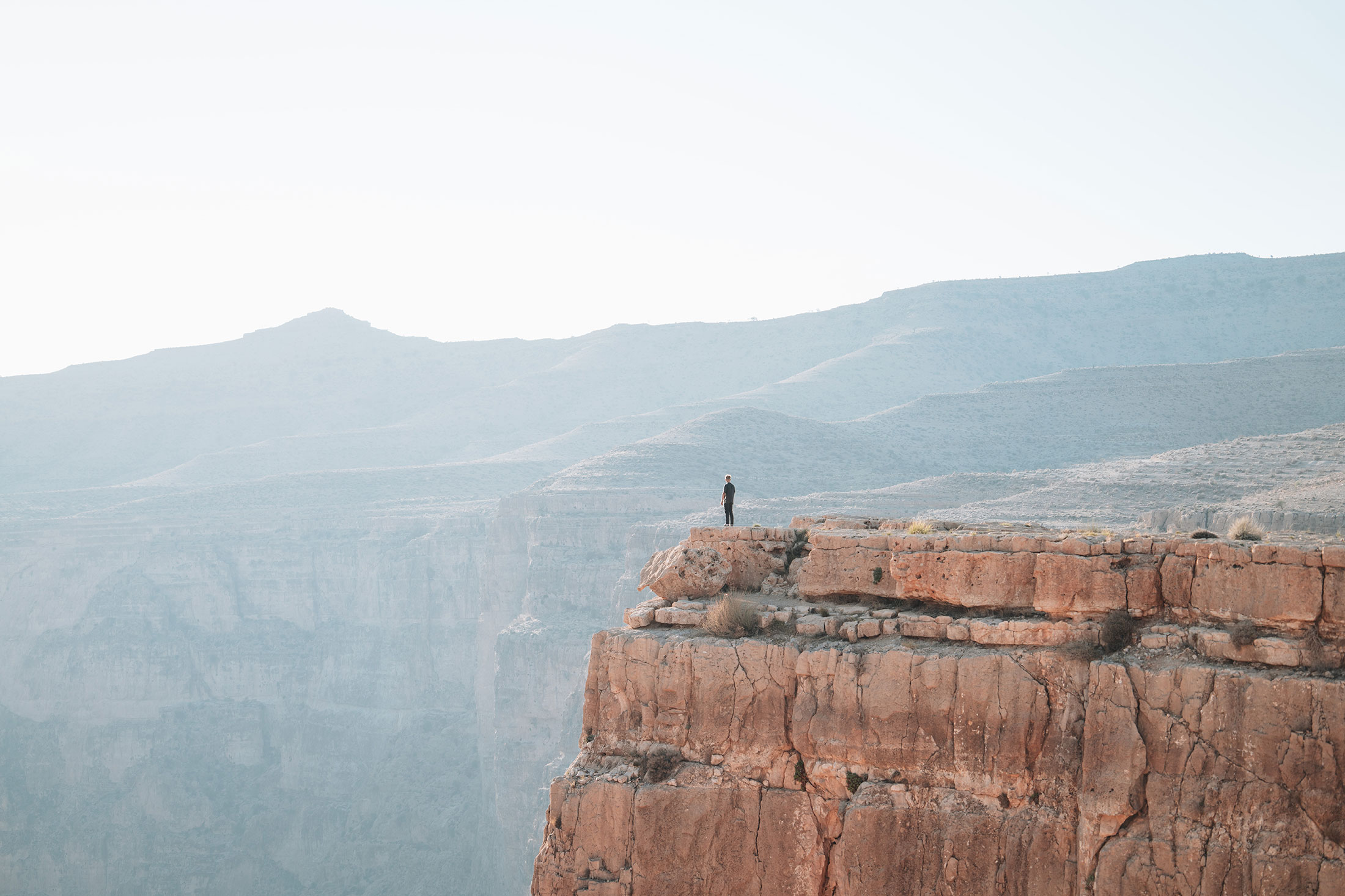 standing on the cliff of haigher valley iran