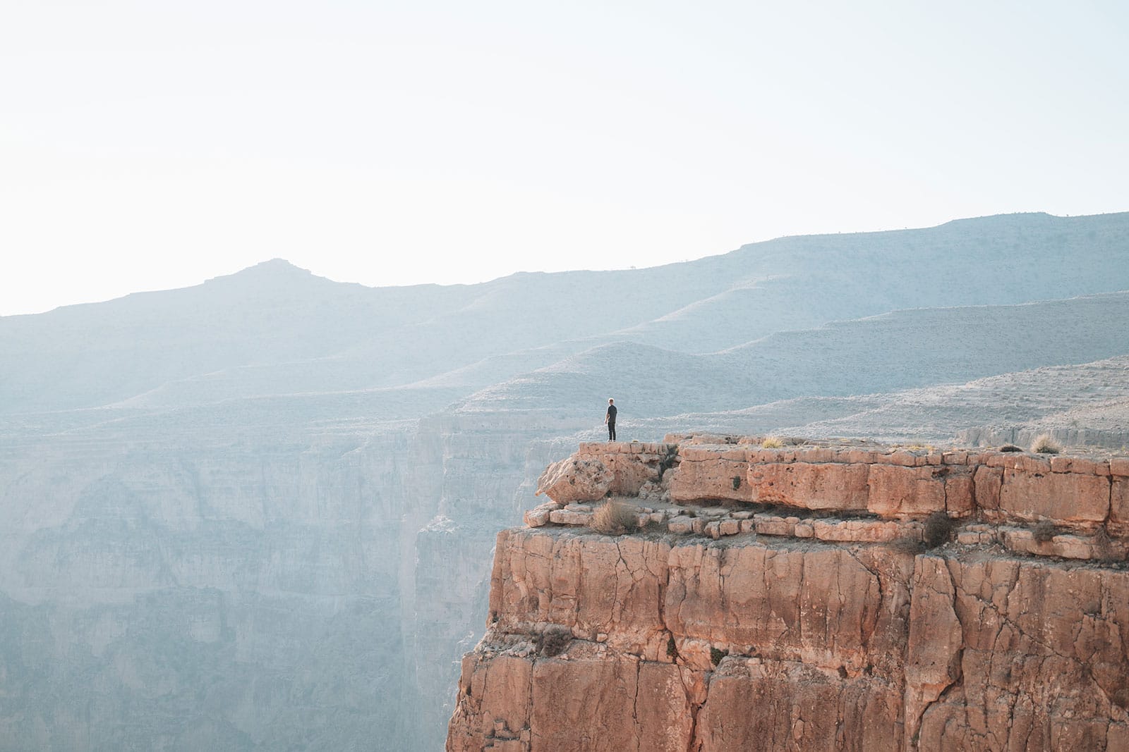 standing on the edge of the grand canyon of iran