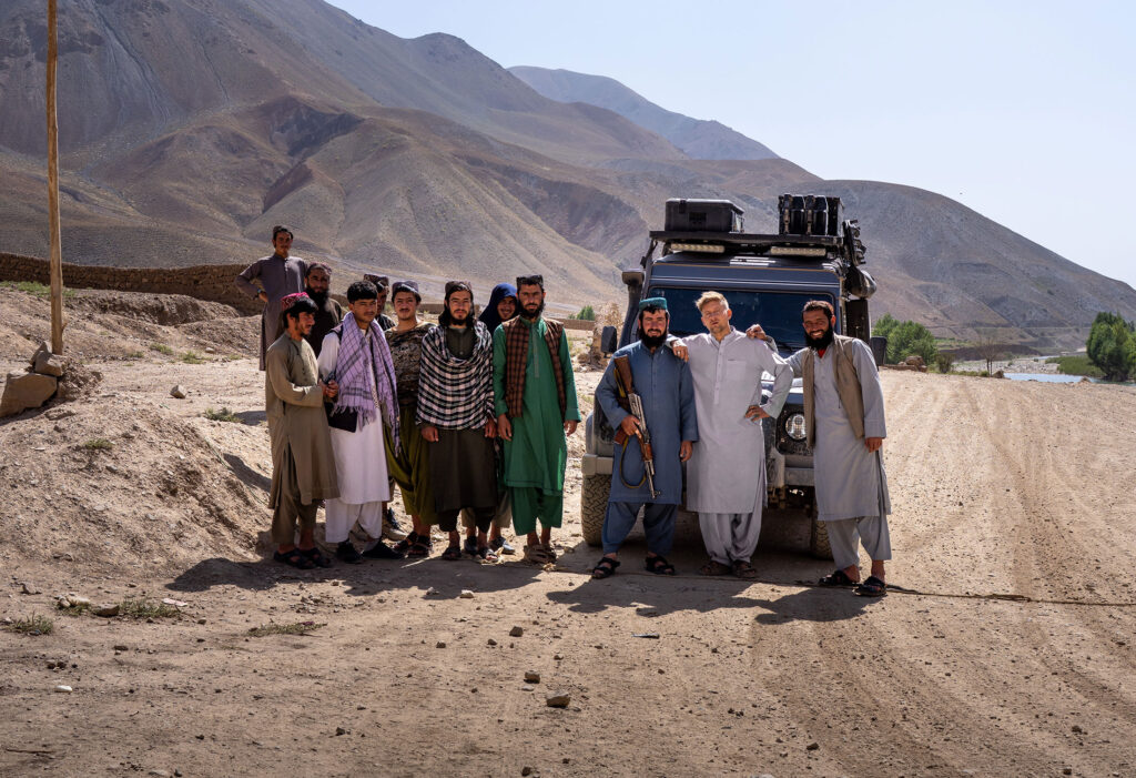 a group of talibans in front of our landrover defender